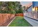 Backyard view with a wooden fence, green grass, and a lovely patio at 1511 Hopkins Ln, Mount Pleasant, SC 29466