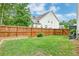 Spacious backyard features a well-maintained lawn and wood fence for privacy at 1511 Hopkins Ln, Mount Pleasant, SC 29466