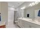 Bathroom with a double sink vanity, large mirror, and a shower-tub combo at 1511 Hopkins Ln, Mount Pleasant, SC 29466