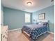 Bright bedroom painted in soft blues with a comfy queen-sized bed at 1511 Hopkins Ln, Mount Pleasant, SC 29466