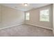 Neutral bedroom with carpet, a ceiling fan, and two windows at 1511 Hopkins Ln, Mount Pleasant, SC 29466