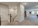 Spacious bonus room featuring stairs, neutral carpeting, and multiple doors at 1511 Hopkins Ln, Mount Pleasant, SC 29466