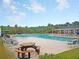 Community pool view with plenty of seating around the deck and pool at 1511 Hopkins Ln, Mount Pleasant, SC 29466