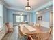 Dining room with a decorative chandelier above the wooden table with wainscoting and trim at 1511 Hopkins Ln, Mount Pleasant, SC 29466