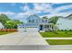 Charming two-story home with a front porch, two-car garage and landscaped yard at 1511 Hopkins Ln, Mount Pleasant, SC 29466