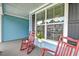 Inviting front porch with rocking chairs and plants at 1511 Hopkins Ln, Mount Pleasant, SC 29466