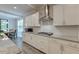 Modern kitchen featuring white cabinetry, granite countertops, and stainless steel appliances at 1511 Hopkins Ln, Mount Pleasant, SC 29466