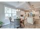 Bright eat-in kitchen features modern appliances, white cabinets, and granite countertops, with large windows for natural light at 1511 Hopkins Ln, Mount Pleasant, SC 29466