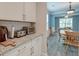 Bright kitchen corner featuring granite countertops, white cabinets, and stainless steel appliances at 1511 Hopkins Ln, Mount Pleasant, SC 29466