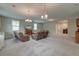 Large living room with plush seating, carpet floors, a tv, and attractive lighting at 1511 Hopkins Ln, Mount Pleasant, SC 29466