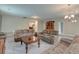 Large living room with plush seating, carpet floors, and attractive lighting at 1511 Hopkins Ln, Mount Pleasant, SC 29466