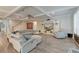 Cozy living room with coffered ceilings, wood floors, and a large sectional sofa for ultimate relaxation at 1511 Hopkins Ln, Mount Pleasant, SC 29466