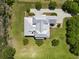 Aerial view of a modern home with a metal roof surrounded by lush greenery at 1518 Bower Ln, Johns Island, SC 29455
