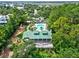 Aerial view of a community pool area surrounded by lush landscaping and amenities at 1518 Bower Ln, Johns Island, SC 29455