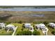 Exclusive waterfront homes, manicured lawns, and pristine waterfront property surrounded by marshes at 1518 Bower Ln, Johns Island, SC 29455