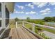 A backyard features a pool and marsh views from the wood deck at 1518 Bower Ln, Johns Island, SC 29455