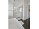 Bright bathroom featuring a soaking tub, glass shower, and white vanity with marble countertops at 1518 Bower Ln, Johns Island, SC 29455