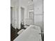 A bathroom features a free-standing tub, white cabinets, a decorative mirror, and pendant lighting at 1518 Bower Ln, Johns Island, SC 29455