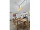 Spacious dining room with a wooden table, modern light fixture, and artwork at 1518 Bower Ln, Johns Island, SC 29455