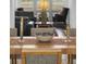 Close-up of the dining table with decorative bowl and glass candlestick holders at 1518 Bower Ln, Johns Island, SC 29455