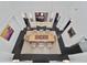 Aerial view of the elegant dining room with a large wooden table and open layout at 1518 Bower Ln, Johns Island, SC 29455