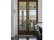 French doors open to porch with marsh views beyond at 1518 Bower Ln, Johns Island, SC 29455