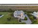 Stunning waterfront home with manicured lawn, mature trees, and a luxurious pool at 1518 Bower Ln, Johns Island, SC 29455