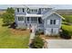 Beautifully designed waterfront home with charming porch, detailed facade, and scenic views at 1518 Bower Ln, Johns Island, SC 29455