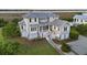 Elegant two-story home with gray siding, white trim and metal roof at 1518 Bower Ln, Johns Island, SC 29455