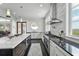 Modern kitchen with marble island, stainless steel appliances, and picturesque water views at 1518 Bower Ln, Johns Island, SC 29455