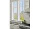 Kitchen details showcase stainless appliances, dark counters, and bright window views at 1518 Bower Ln, Johns Island, SC 29455