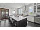 Bright and modern kitchen with marble countertops, stainless steel appliances, and an island at 1518 Bower Ln, Johns Island, SC 29455