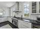 Gourmet kitchen boasts stainless appliances, sleek countertops, and ample natural light at 1518 Bower Ln, Johns Island, SC 29455