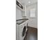 Well-lit laundry room equipped with a stainless-steel countertop and modern washer and dryer at 1518 Bower Ln, Johns Island, SC 29455