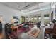 Spacious living room with high ceilings, fireplace, stylish furniture, and water views at 1518 Bower Ln, Johns Island, SC 29455