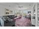 Comfortable living room with plush seating, a patterned rug, and scenic views from large windows at 1518 Bower Ln, Johns Island, SC 29455