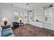Bright living room featuring a vintage rug, blue sofa and built-in shelving at 1518 Bower Ln, Johns Island, SC 29455