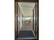 Open doorway onto a covered porch with a view of the marsh at 1518 Bower Ln, Johns Island, SC 29455