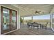 Covered porch with comfortable seating and panoramic views of the marsh at 1518 Bower Ln, Johns Island, SC 29455