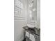 Elegant powder room with vessel sink, dark countertop and chrome accents at 1518 Bower Ln, Johns Island, SC 29455