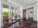 Bright sitting area with a glass table and large windows that flood the space with natural light at 1518 Bower Ln, Johns Island, SC 29455