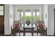 Bright sitting area with a glass table and large windows offering a beautiful view at 1518 Bower Ln, Johns Island, SC 29455