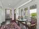 Inviting sitting area with a glass table and a view of the staircase at 1518 Bower Ln, Johns Island, SC 29455