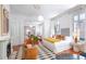 Elegant bedroom featuring a seating area, hardwood floors, and seamless access to the living room at 155 Wentworth St # A, Charleston, SC 29401