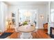 Open dining space showcasing a wood table, stylish chairs, and a view into the adjacent living area at 155 Wentworth St # A, Charleston, SC 29401