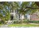 Charming home with beautiful curb appeal, featuring mature trees, lush landscaping, and a classic facade at 155 Wentworth St # A, Charleston, SC 29401