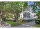 Elegant home showcasing a multi-story veranda, manicured lawn, and a paved driveway at 155 Wentworth St # A, Charleston, SC 29401