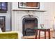 Ornate fireplace with detailed carvings, adding a touch of historic charm to the room at 155 Wentworth St # A, Charleston, SC 29401