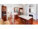 Open concept kitchen with marble island, stainless steel appliances, and seamless flow to adjacent dining area at 155 Wentworth St # A, Charleston, SC 29401