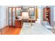 Modern kitchen features custom wood cabinets, stainless steel appliances, and a marble island with seating at 155 Wentworth St # A, Charleston, SC 29401